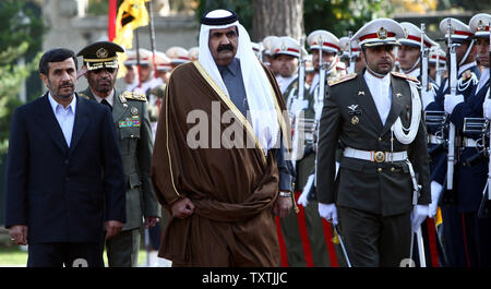 Iranian President Mahmoud Ahmadinejad (L) welcomes Qatari Emir Sheik Hamad Bin Khalifa Al Thani during official an welcoming ceremony in Tehran, Iran on December 20, 2010.     UPI/Maryam Rahmanian Stock Photo