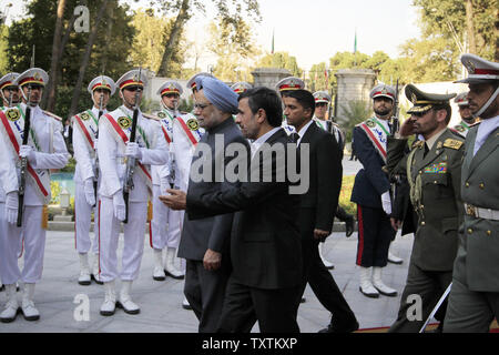 Iranian President Mahmoud Ahmadinejad greets Indian Prime Minister Manmohan Singh during an official welcome ceremony in Tehran, Iran on August 29, 2012.  Singh is in Tehran to attend the 16th Non- Aligned Movement (NAM) Summit.       UPI/Maryam Rahmanian Stock Photo