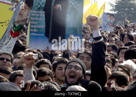 An Iranian man shouts at Azadi Square (Freedom Square) during the celebration of the 34th anniversary of the Islamic Revolution in Tehran, Iran on February 10, 2013. Ahmadinejad told the crowd that Iranian nation is as strong as it could be and no one can impose their will on the Iranian nation. He also added 'Today, enemies are making every effort to stop the progress of the Iranian nation by increasing pressure, but they have not been successful.'     UPI/Maryam Rahmanian Stock Photo