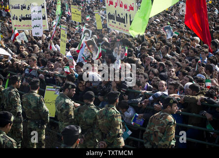 Iranian police stand guard as the Iranians gather at Azadi Square (Freedom Square) for the celebration of the 34th anniversary of the Islamic Revolution in Tehran, Iran on February 10, 2013. Ahmadinejad told the crowd that Iranian nation is as strong as it could be and no one can impose their will on the Iranian nation. He also added 'Today, enemies are making every effort to stop the progress of the Iranian nation by increasing pressure, but they have not been successful.'     UPI/Maryam Rahmanian Stock Photo