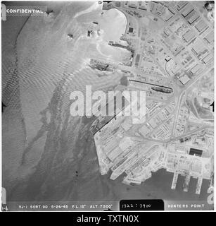 [Aerial photograph shot at 7000 feet altitude, showing one unidentified CVL type carrier in docks along with several other ships. Hunters' Point (San Francisco Naval Shipyard) San Francisco, CA] Stock Photo