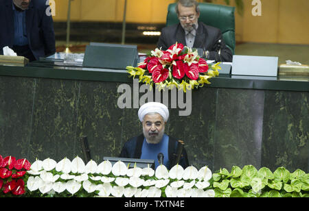 Iran's new president Hassan Rouhani (R) delivers a speech during his inauguration ceremony at the Iranian Parliament in Tehran, Iran on August 4, 2013. Rouhani urged an end to international sanctions in a speech during his inauguration ceremony.     UPI/Maryam Rahmanian Stock Photo