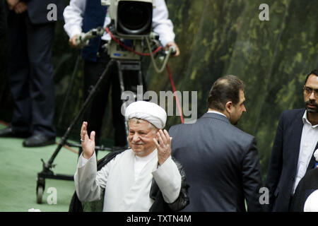 Former President Akbar Hashemi Rafsanjani waves to the members of the Iranian Parliament during the inauguration ceremony for Iran's new president Hassan Rouhani in Tehran, Iran on August 4, 2013. Rouhani was endorsed by Supreme Leader Ayatollah Khamenei on August 3, to succeed Mahmoud Ahmadinejad, who served for eight years.     UPI/Maryam Rahmanian Stock Photo