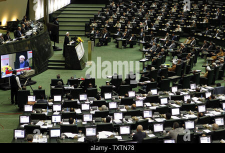 Iran's President Hassan Rouhani speaks to the members of the Iranian parliament on the last day of decision making over his new cabinet on August 15, 2013 in Tehran, Iran. Rouhani submitted his proposed cabinet during his swearing-in ceremony in parliament on August 4, 2013.    UPI/Maryam Rahmanian Stock Photo