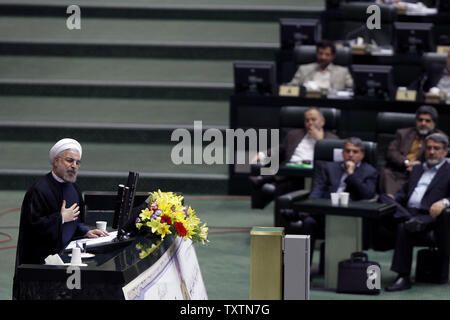 Iran's President Hassan Rouhani  speaks to members of the Iranian parliament on the last day of decision making over his new cabinet on August 15, 2013 in Tehran, Iran. Rouhani submitted his proposed Cabinet during his swearing-in ceremony in parliament on August 4, 2013. Parliament rejected three out of 18 of his cabinet nominees.     UPI/Maryam Rahmanian Stock Photo