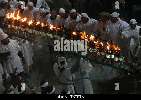 Pilgrims attend a religious ceremony in Karbala, Iraq on January 7, 2009. Hundreds of thousands of Shiite pilgrims converge on Karbala for Ashura, a ten day mourning period marking the seventh century martyrdom of Imam Hussein, grandson of the prophet Mohammad.  (UPI Photo/Ali Jasim) Stock Photo