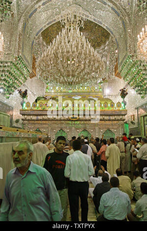 Iraqi pilgrims pray at the shrine of Imam Musa al-Kazim in Baghdad, Iraq on May 8, 2009. (UPI photo/Ali Jasim) Stock Photo