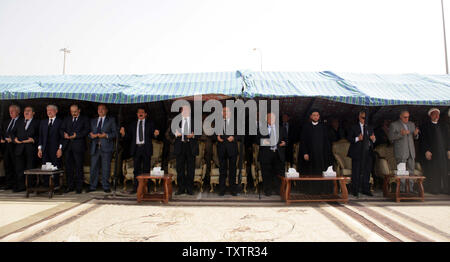 Groups of officials including Ammar al-Hakim (2nd R), son of Abdul Aziz al-Hakim, Iraq's President Jalal Talabani (3rd R) and Iraq's Prime Minister Nuri al-Maliki (3rd L) pray during a funeral ceremony for Abdul Aziz al-Hakim, leader of the Supreme Islamic Iraqi Council (ISCI), at Baghdad's airport on August 28, 2009. Iraq declared three days of mourning on Thursday for the leading Shi'ite cleric and politician whose death may intensify political instability before national elections.  UPI/Ali Jasim Stock Photo