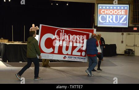 Campaign workers carry a sign to an event prior to the arrival of Texas Sen. Ted Cruz, 2016 Republican presidential candidate and conservative political commentator and radio and TV host Glenn Beck for a 'Keep the Promise' rally at Faith Baptist Bible College, January23, 2016, in Ankeny, Iowa. Cruz is running against a large field of GOP candidates, including real estate mogul Donald J. Trump, Florida Sen. Marco Rubio and retired neurosurgeon Ben Carson ahead of Iowa's first-in-the-nation caucuses, February 1.      Photo by Mike Theiler/UPI