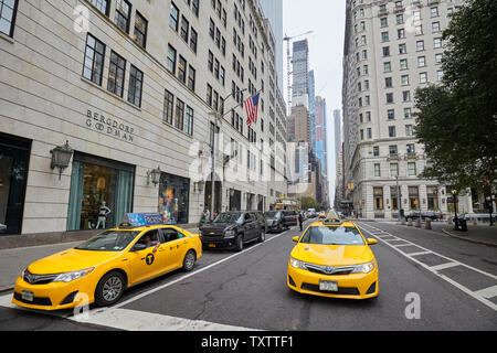New York, USA - July 04, 2018: New York medallion taxicab vehicles on a street of Manhattan. Stock Photo