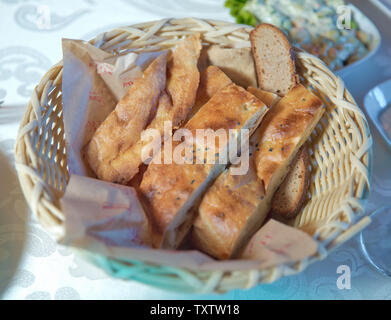 Chopped bread in the basket . Garlic breads in the basket . Pieces of bread. Cut bread.Bread in basket Stock Photo