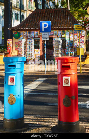 Red and blue postboxes in front of the Municiple garden Funchal in the Old Town, Madeira, Portugal, European Union Stock Photo