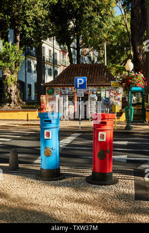 Red and blue postboxes in front of the Municiple garden Funchal in the Old Town, Madeira, Portugal, European Union Stock Photo