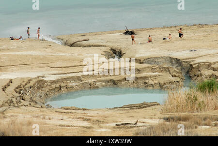 Israelis relax near sinkholes on the western shore of the Dead Sea, April 28, 2007. The Dead Sea is the lowest point on earth and the second saltiest body of water in the world. In recent years it has been shrinking. (UPI Photo/Debbie Hill)