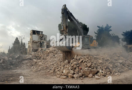 Israeli bulldozers demolish the Shepherd Hotel in the East Jerusalem ...