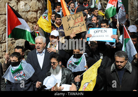Palestinians, Israelis and international activists protest against the closure of Shuhada Street to Palestinians in Hebron, West Bank, February 25, 2011. Demonstrators shouted slogans against the U.S. for vetoing the UN Security Council resolution condemning Israeli settlements.  UPI/Debbie Hill. Stock Photo