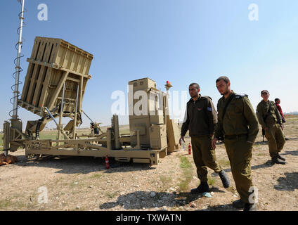 Israeli soldiers walk near the Iron Dome, a new anti-rocket system, stationed near the southern city of Beersheba, Israel, March 27, 2011. The Israeli Defense Force deployed the $200 million Iron Dome system in response to dozens of rockets fired by Palestinian militants from Gaza in the past weeks. The Iron Dome is meant to protect Israeli towns from rockets fired from Gaza.   UPI/Debbie Hill Stock Photo