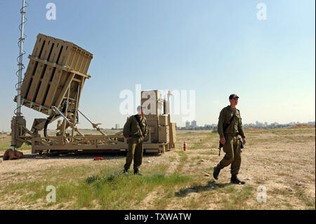 Israeli soldiers stand near the Iron Dome, a new anti-rocket system, stationed near the southern city of Beersheba, Israel, March 27, 2011. The Israeli Defense Force deployed the $200 million Iron Dome system in response to dozens of rockets fired by Palestinian militants from Gaza in the past weeks. The Iron Dome is meant to protect Israeli towns from rockets fired from Gaza.   UPI/Debbie Hill Stock Photo