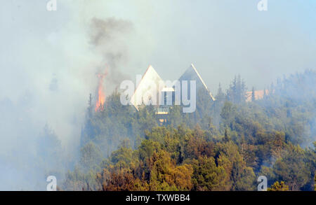 A forest fire burns in the forest below the Yad Vashem Holocaust Museum in Jerusalem on Sunday, July 17, 2011. An out of control wildfire forced the evacuation of Israel's Holocaust Museum Yad Vashem.  UPI/Debbie Hill Stock Photo
