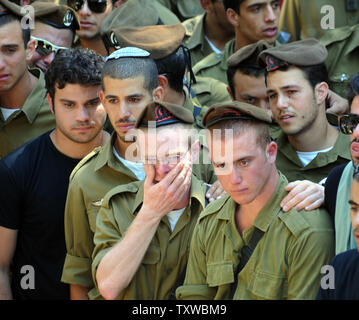 Israeli soldiers cry during the funeral of Staff Sergeant Moshe Naftali, 22, at the Mount Herzl Military Cemetery in Jerusalem, August 19, 2011. Naftali was killed in southern Israel  in a terrorist attack yesterday. Eight Israelis were killed in three terrorists attacks by Palestinians from Gaza who crossed into Israel through Egypt.  UPI/Debbie Hill Stock Photo