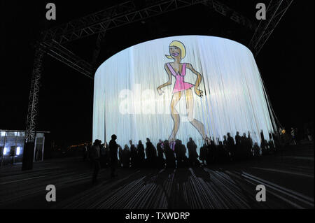 Visitors Watch Videos On A Monumental Installation By Israeli Designer Ron Arad Called An