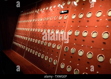 Antalya, Turkey - May 20, 2019: Coins at the Antalya Antiquities Museum. Old coins on the rack with light. Stock Photo