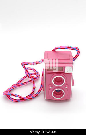 Vintage pink-fuchsia plastic slide viewer pencil sharpener, isolated on white background, close-up Stock Photo