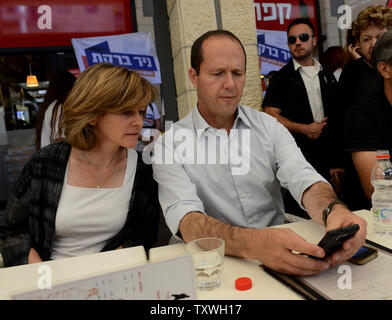 Jerusalem Mayor and candidate in Israel's municipal elections, Nir Barkat, checks his cellphone while campaigning in Jerusalem, Israel, October 22, 2013. UPI/Debbie Hill Stock Photo