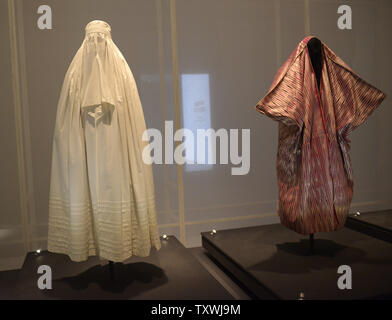 A Jewish women's wrap and face veil from Afghanistan is seen in the exhibition 'DRESS CODES - Revealing the Jewish Wardrobe' in the Israel Museum in Jerusalem, Israel, March 11, 2014. The exhibit explores the roots of traditional clothing in Jewish fashion from around the world. Over one hundred costumes from four continents are displayed in the exhibit that opens tonight..UPI/Debbie Hill. Stock Photo