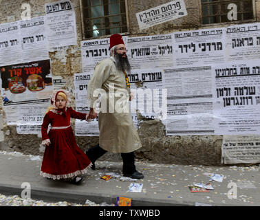 An Ultra-Orthodox Jewish girl wears a costume on the feast of Purim in Mea Shearim in Jerusalem, Israel, March 17, 2014. The Purim holiday commemorates the deliverance of the Jewish people from genocide in ancient Persia, as recounted in the book of Esther.  UPI/Debbie Hill.. Stock Photo