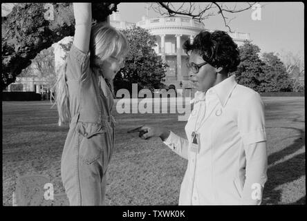Amy Carter playing on the White House grounds with Mary Fitzpatrick. Stock Photo