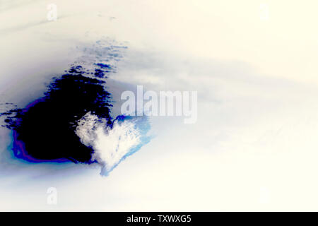 Heart shaped white cloud with tinted shadow on the inverted pastel color sky background with copy space Stock Photo