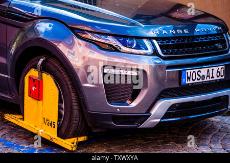 Wheel Clamp on parked car in Praha, Czech Republic Stock Photo