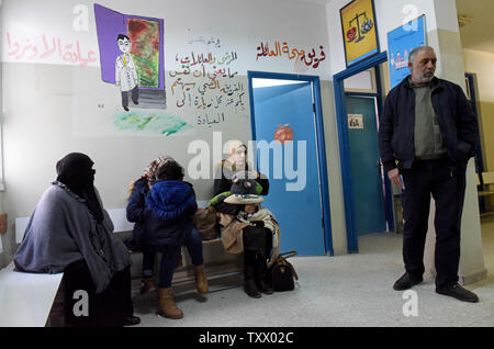 Palestinians Wait To See The Doctor In The Unrwa Health Clinic In