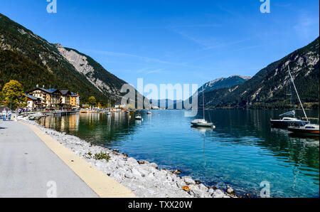 View on Achensee - Achen Lake. With boats (boat), sailboats (sailboat), mountains. Tirol, Austria. Stock Photo