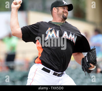 Miami Marlins pitcher Heath Bell throws to the New York Mets at the Roger  Dean Stadium in Jupiter, Florida on March 15, 2012. The Miami Marlins beat  the New York Mets 3-1.