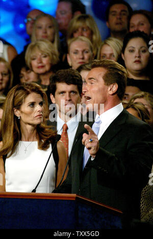 California's governor-elect, Arnold Schwarzenegger and wife Maria Shriver celebrate his win in the recall election at the Century Plaza Hotel in Los Angeles, California on October 7, 2003.      (UPI/Ken James) Stock Photo