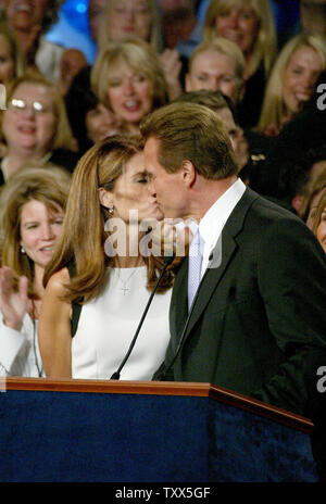 California's governor-elect, Arnold Schwarzenegger and wife Maria Shriver celebrate his win in the recall election at the Century Plaza Hotel in Los Angeles, California on October 7, 2003.    (UPI/Ken James) Stock Photo