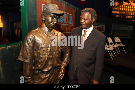 National Baseball Hall of Fame member Lou Brock stands with the bronze statue of Negro Leaguer Oscar Charleston while at the Negro Leagues Baseball Museum in Kansas City on July 9, 2012. Brock was on hand to accept the Jackie Robinson Lifetime Achievement Award. UPI/Bill Greenblatt