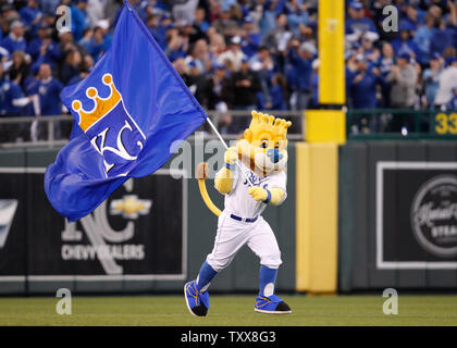 Ace the mascot of the Toronto Blue Jays waves a Canadian flag the