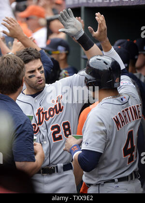 Detroit Tigers designated hitter Miguel Cabrera kisses his son