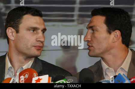 Former WBC heavyweight boxing champion Vitali Klitschko (L) and his younger brother Vladimir chats during a joint news conference in Kiev on March 16, 2007. The Ukrainian boxers announced their plans for the future. (UPI Photo/Sergey Starostenko)