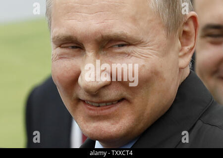 Russian President Vladimir Putin smiles as he visits National Grain Center in Krasnodar, 750 ml south from Moscow, on March 12, 2018 six days ahead of presidential elections in Russia. Photo by Yuri Gripas/UPI Stock Photo