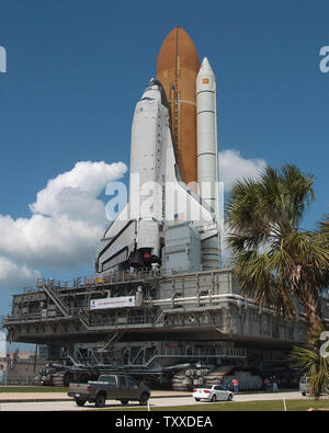 Space Shuttle 'Discovery', slated to launch on May 15, 2005, rolls out to Launch Complex 39B on April 6, 2005 at the Kennedy Space Center, Florida. The mobile transporter that reaches a maximum speed of one mile per hour transports the eighteen million pound launch vehicle to the pad. Discovery's launch will mark NASA's return to flight since the Columbia disaster over two years ago. (UPI Photo/Marino/Cantrell) Stock Photo