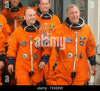 NASA mission STS-123 Commander Dominic Gorie (R), mission specialist Garrett Reisman (L) and mission specialist Michael Foreman make their way to Launch Pad 39A to board Space Shuttle Endeavour at NASA's Kennedy Space Center in Florida on March 10, 2008. The seven-man crew is scheduled to launch on mission STS-123, a 16-day service mission to the International Space Station to install the Japanese-built Kibo laboratory and the Canadian Space Agency's  robotic arm system, at 2:28 a.m. on March 11, 2008. (UPI Photo/Kevin Dietsch) Stock Photo
