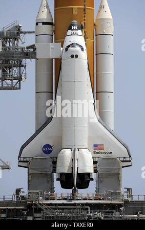 As the rotating service structure rolls back, NASA's Space Shuttle 'Endeavour' sits prepared for launch from Complex 39A on mission STS 127 from the Kennedy Space Center in Florida on June 12, 2009. Endeavour and her seven person crew will fly to the International Space Station to install the Kibo module as well as add equipment planned for future repairs during the planned sixteen day mission. (UPI Photo/Joe Marino - Bill Cantrell) Stock Photo