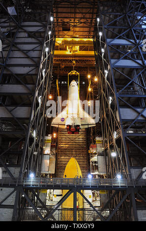 NASA lifts space shuttle 'Atlantis' before attaching her to the external tank and boosters at the Kennedy Space Center on May 18, 2011. Atlantis will fly the program's 135th space shuttle mission in its thirty year history. Atlantis will launch a crew of four to the International Space Station on a sixteen day mission. The orbiter and her crew will deliver supplies to the complex to equip the station for the post shuttle era. UPI/Joe Marino-Bill Cantrell Stock Photo