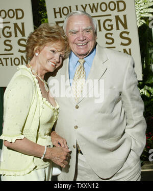 Actor Ernest Borgnine and his wife, Tova,  pose for photographers at the Hollywood Foreign Press Association Annual  (HFPA) Installation Luncheon at the Beverly Hills Hotel in Beverly Hills, California on August 11, 2004. The HFPA bestows the annual Golden Globe Awards and presented over $1 million in financial grants to films schools and non-profit organizations during the luncheon. (UPI Photo/Francis Specker) Stock Photo