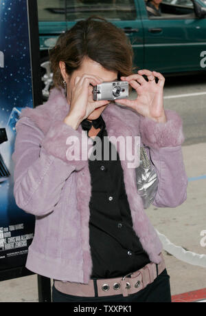 Actress Nia Vardalos takes a photos with her camera  at the November 7, 2004 Los Angeles  premiere of the new animated film 'Polar Express'. The film, starring Tom Hanks, is  based on the children's book of the same name and directed by Robert Zemeckis, opens in the United States November 10. (UPI Photo/Francis Specker) Stock Photo