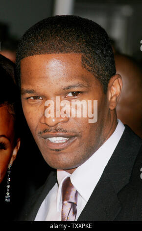 Actor Jamie Foxx poses for photographers before a concert paying